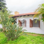 Casa em condomínio fechado com 4 quartos à venda na Avenida Guarujá, 199, Guarujá, Porto Alegre