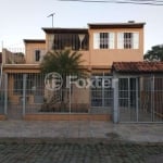 Casa com 4 quartos à venda na Acesso Três, 4258, Restinga, Porto Alegre