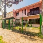 Casa com 5 quartos à venda na Rua Monteiro Lobato, 395, Partenon, Porto Alegre