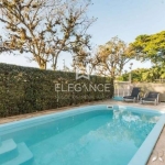 Elegance imóveis vende casa, 320m, 3 dormitórios, 1 suíte, closet, amplo living, churrasqueira, piscina e 5 vagas de garagem. Comprar R$ 1.980.000,00