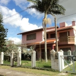 Casa sobrado com quatro quartos,  dois são suítes. Dois banheiros sociais  três salas + avarandado térreo  em L, sala de jantar e estar com lareira cozinha ampla estilo americana , planejada  mezanino