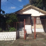 Uma casa no bairro Medianeira com 4 dormitórios ,1 suíte, Living amplo 2 ambientes com lareira, 1 Copa Cozinha, 1 banheiro social, 2 vagas cobertas ,Pátio com área de lazer ( churrasqueira e  banheiro