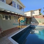 Casa em Mongaguá, bairro Jardim Marabá, vista para o mar, 4 dormitórios sendo 1 suíte, lazer com salão de jogos e piscina com cascata.