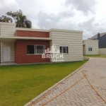 Bruck Imóveis vende. Casa térrea em condomínio fechado, 2 dormitórios, 1 suíte, 2 banheiros e 2 vagas/box de estacionamento, no bairro Lagos de Nova Ipanema, zona sul de Porto Alegre, próximo ao Zaffa