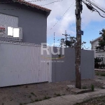 Casa no Bairro Guarujá com 2 (dois) dormitórios , opção do terceiro na parte de cima da casa, sala de estar e jantar, churrasqueira, sala com lareira, cozinha, lavabo, banho social e auxiliar. Pátio c