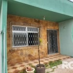 Casa à venda no bairro Rio Branco | O imóvel conta com 3 dormitórios sendo 1 suite, sala de jantar e sala de estar, cozinha, 2 banheiros, área de serviço e garagem. Além de um salão de festa com 1 dor