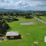 Sítio à venda no bairro Lami | Sítio com 1,5H, conta com casa de 2 dormitórios sendo 1 suite, sala e cozinha integradas com fogão campeiro. Conta também com uma segunda casa de madeira para caseiro co