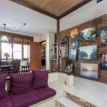 Casa de Alvenaria, possui 3 dormitórios, uma suíte, hall de entrada, lavabo,  living com lareira, cozinha ampla com armários, área gourmet com churrasqueira, corredor, pátio e 4 vagas de garagem, uma 