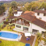 Casa em ampla terreno com 4 suítes à venda, 593 m² por R$ 12.000.000 - Água Branca - Ilhabela/SP