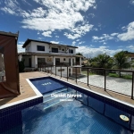 Casa à Venda em Villas do Atlântico - Lauro de Freitas | 5 quartos | Nascente | Piscina Características do Imóvel: - 5 quartos, sendo 4 suítes- Dois quartos na parte inferior e trê