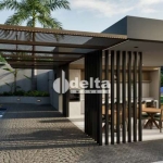 Bairro planejado e próximo à natureza. Casas em condomínio fechado na zona sul de Uberlândia, Casas com 70.42m², Sala com pé direito de 4 metros. Cozinha integrada com área gourmet com churrasqueira a