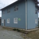 Casa comercial a venda bairro Ponte do Imaruim, em Palhoça, conta com 4 apartame