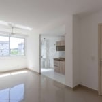 Excelente apartamento com 2 dormitórios, amplo living que integra a sala de estar à sala de jantar com ventilador de teto, cozinha americana e com armários, área de serviço/lavanderia, banheiro com bo