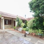 Casa térrea com  hall de entrada ,4 dormitórios, sendo duas suítes , duas salas , copa cozinha , lavanderia , churrasqueira , jardim de inverno, banheiro social, amplo pátio com, uma sala depósito, , 