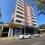 Apartamento de três dormitórios com sacada e churrasqueira.