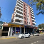 Apartamento de dois dormitórios com sacada e churrasqueira.