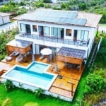 CASA A VENDA EM PRAIA DO FORTE, LITORAL NORTE DA BAHIA - Condomínio Praia Bella, acesso direto à praia, 5 suítes de alto padrão porteira fechada.