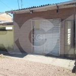 Vende terreno com duas casas, nos fundos com dois dormitórios, banheiro, sala, cozinha, área de serviço. Na frente sala comercial,  cozinha, banheiro, casa toda gradeada. Agende sua visita com nossos 