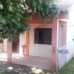 Terreno medindo 12m  por 49 m, com 2 casas em alvenaria.  Casa 1 fica na parte da frente do terreno, conta com 2 dormitórios amplo sala  com lareira, cozinha americana, banheiro social, área de serviç