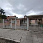 Casa no bairro Aberta dos Morros, com 3 dormitórios, sendo uma suíte. Amplo living com lareira, sala de jantar, lavabo, cozinha e área de serviço. Pátio aos fundos com um sobrado com sala, lavabo, coz