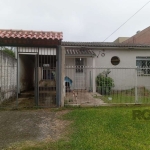 Casa à venda em Porto Alegre, no Bairro Mário Quintana. Com 2 dormitórios, 1 banheiro social, 2 vagas de garagem. Localizada em rua tranquila e plana. Possui living em 2 ambientes, quintal e bom estad