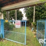 Imóvel para venda em Porto Alegre/RS Zona Sul | Mini Sítio com uma casa de alvenaria, 1 dormitório, sala e cozinha integradas, 1 banheiro. Área externa com churrasqueira, pomar e uma horta, espaço com