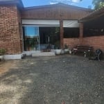 Casa à venda no bairro Boa Vista Zona Sul de Poa | O imóvel conta com 3 dormitórios, sala, cozinha, escritório, banheiro, lavabo, lavanderia com dispensa, varanda fechada com vidros, área de churrasco