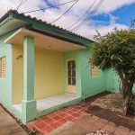 Casa à venda - Rua Boa Vista, Bairro Rio Branco, Canoas/RS. Imóvel em terreno plano de 10 x 38m, com uma casa de alvenaria desocupada. A casa principal conta com 2 quartos, sala, sala de jantar, cozin