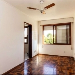 Excelente apartamento para venda composto por 2 dormitórios, cozinha e área de serviço integradas, living para dois ambientes, banheiro e circulação. Piso em parquet, 01 ar condicionado de parede no q