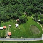 Sítio à venda no bairro Lami | Lindo sítio em frente ao asfalto com 3H, conta com 3 casas, a primeira com 2 dormitórios sendo 1 suite, sala, cozinha, banheiro e área na lateral da casa. A segunda casa