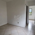 Apartamento térreo  tipo casa de 46m², 2 dormitórios, vaga de garagem junto ao apartamento com entrada fechada e porta com sáida direto para o pátio do condomínio, em condomínio próximo ao Posto Tinga