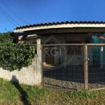 Terreno com 02 casas no pátio. 1º casa com 02 dormitórios, sala, cozinha, banheiro com box de acrílico, balcão dividindo sala e cozinha, área de serviço, garagem coberta para 01 carro e passagem later