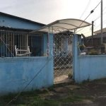 Amplo terreno com ótima localização no bairro Camaquã, composto por 2 casas individuais. Casa da frente com 2 dormitórios, living para 2 ambientes com lareira, cozinha com passa pratos, banheiro socia