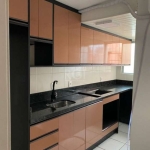 Vende-se apartamento térreo desocupado, semi mobiliado, 2 dormitórios, living amplo em 2 ambientes, copa e cozinha, área de serviço e 1 vaga de garagem. Prédio com salão de festas, zeladoria, churrasq