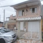 VENDO no bairro Partenon em Porto Alegre Casa estilo sobrado com 03 dormitórios. Na parte superior sacada, 3 dormitorios sendo 01 suite e liviing para 02 ambientes No térreo 2 salas grandes, cozinha s