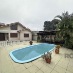 Vendo casa térrea 3 Dormitórios, suíte com hidromassagem e um dos dormitórios possui mezanino. O deck da piscina é equipado com espaço gourmet, salão de festas com churrasqueira em cima da garagem. A 