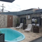 Casa no bairro Restinga com piscina com 4 dormitórios