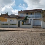 Excelente Sobrado 3 dormitórios sendo 1 suíte, 3 vagas, Piscina aquecida, energia solar.