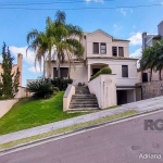 Linda casa semi mobiliada, com 4 suítes, sendo uma no andar térreo e as outras no segundo pavimento, living 2 ambientes com lareira e churrasqueira, cozinha planejada, área de serviço, lavabo, amplo p