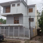 Casa  Nova Triplex com Três do dormitórios sendo uma suite , sacada , lareira na sala de  estar , três banheiros , duas vagas de garagem