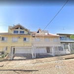 Casa de 5 dormitórios, sendo 1 suíte com hidromassagem, com 3 andares no bairro Sarandi. Despensa, cozinha ampla, lavabo, escritório, living, lareira churrasqueira, tabuão, lareira, garagem para 4 car