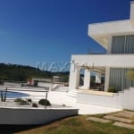 Casa alto padrão de  608m², 4 suítes, 12 vagas, piscina, pé direito alto e Porteira fechada.