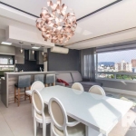 Apartamento semi mobiliado com três dormitórios sendo um suíte, churrasqueira, cozinha americana integrada com living dois ambientes, lavabo, andar alto com vista definida. São duas vagas de garagem c