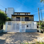 Casa à venda no bairro Hípica | Imóvel de 3 pavimentos com 4 dormitórios sendo 1 suite, sala de estar, sala de jantar, cozinha, banheiro social, área gourmet com churrasqueira, lavanderia, lavabo, sac