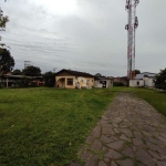 Casa de Alvenaria,2 dormitórios,banheiro social,living 2 ambientes,cozinha,garagem fechada .