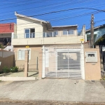 2 casas no bairro Santa Tereza, sendo a de frente com dois dormitórios e a de fundos com três quartos e duas vagas.