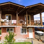 A venda terreno com duas casas mais pavilhão, localizada em Canela.