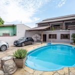 Casa com 5 dormitórios, 1 suíte, espaço gourmet e piscina. A venda no Bairro Rio Branco em Canoas-Rs