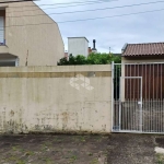 Terreno murado de 200m² no bairro Igara, com garagem e portão eletrônico.