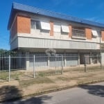 Excelente Prédio com Amplo Apartamento com 3 dormitórios, suíte no segundo andar com garagem e 3 lojas grandes no térreo em avenida no bairro Sarandi